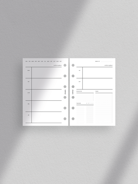 Pocket size. Comprehensive weekly planner layout. Includes week at a glance, priorities, tasks, tracker. Features week on two pages design. Minimalist and sleek aesthetic. Perfect for efficient organization and goal achievement.